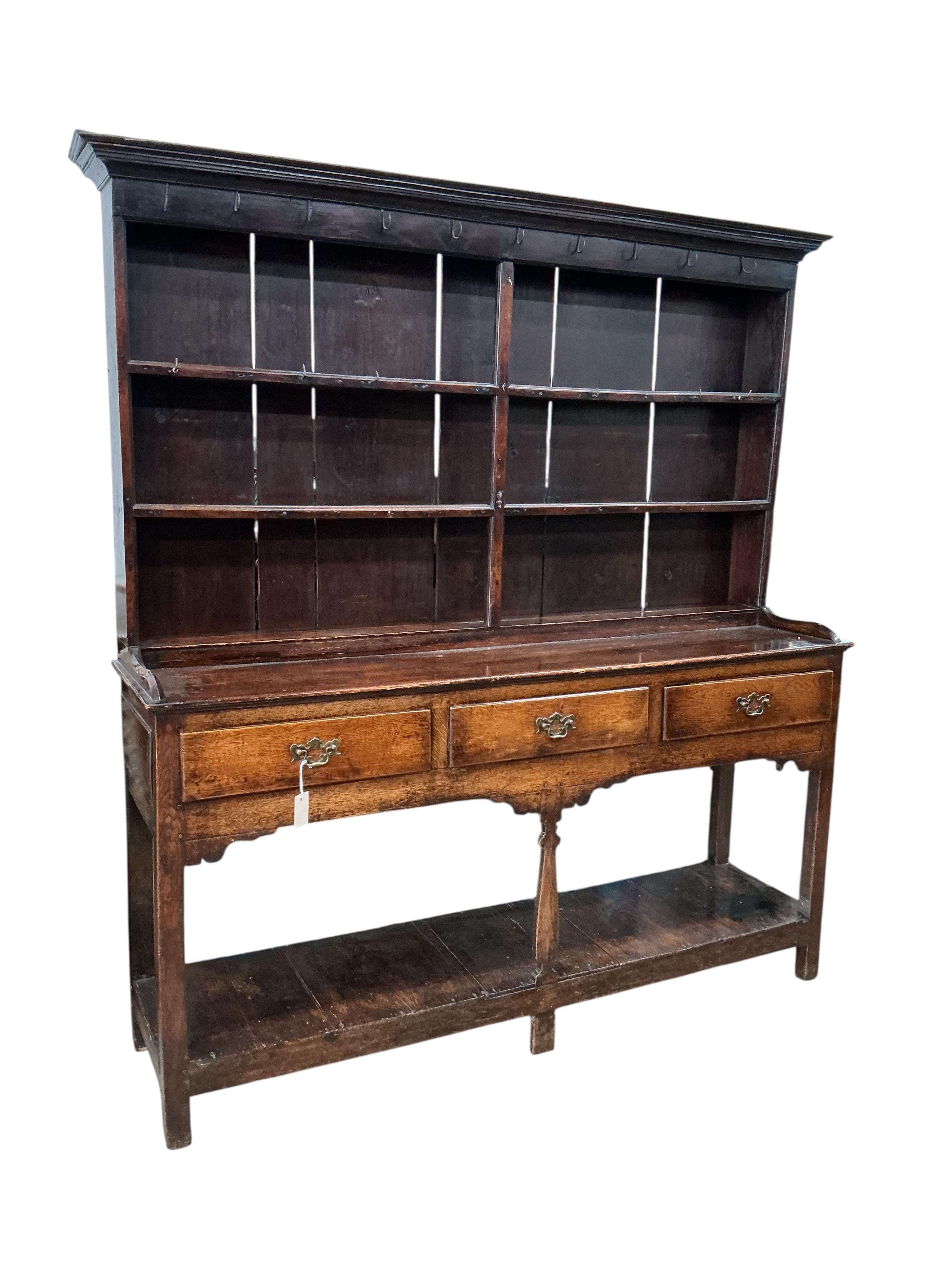 An 18th century oak and pine potboard dresser, with boarded rack, width 169cm, depth 43cm, height 187cm